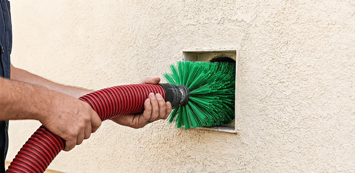 Air duct cleaning brush removing debris from a vent opening in Fargo, ND