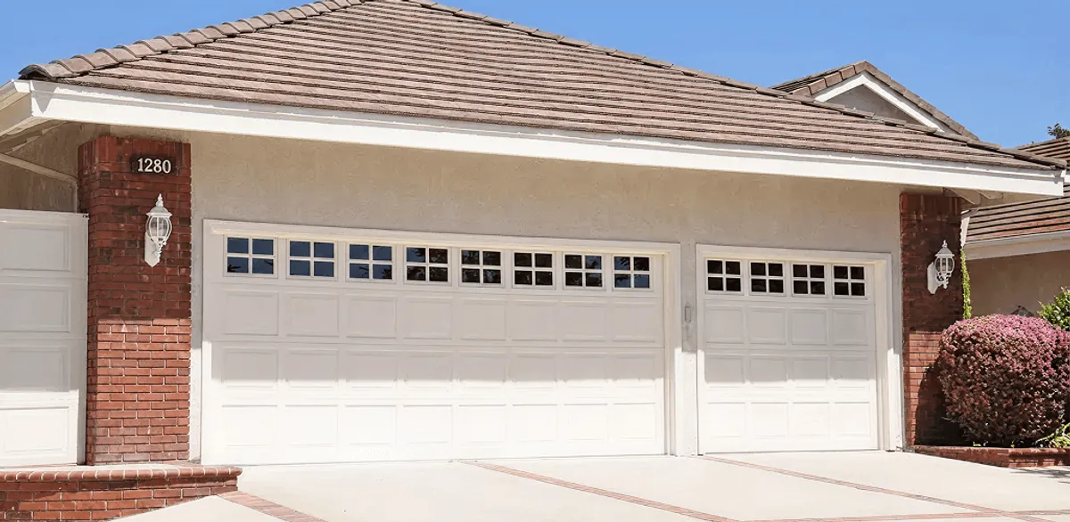 Residential garage door repair service for a double garage door in Fargo, ND